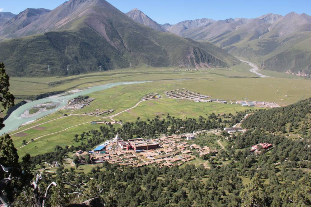 Reting forest, Reting Monastery and the Kyi Chu valley with treeles slopes around.